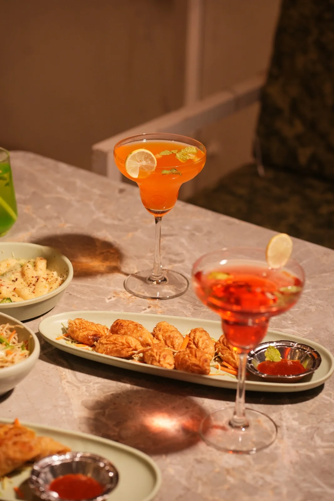Pasta, noodles, chaat, snacks and colourful drinks on the table. Nasha Chai Sutra, SFS Mansarovar Jaipur.