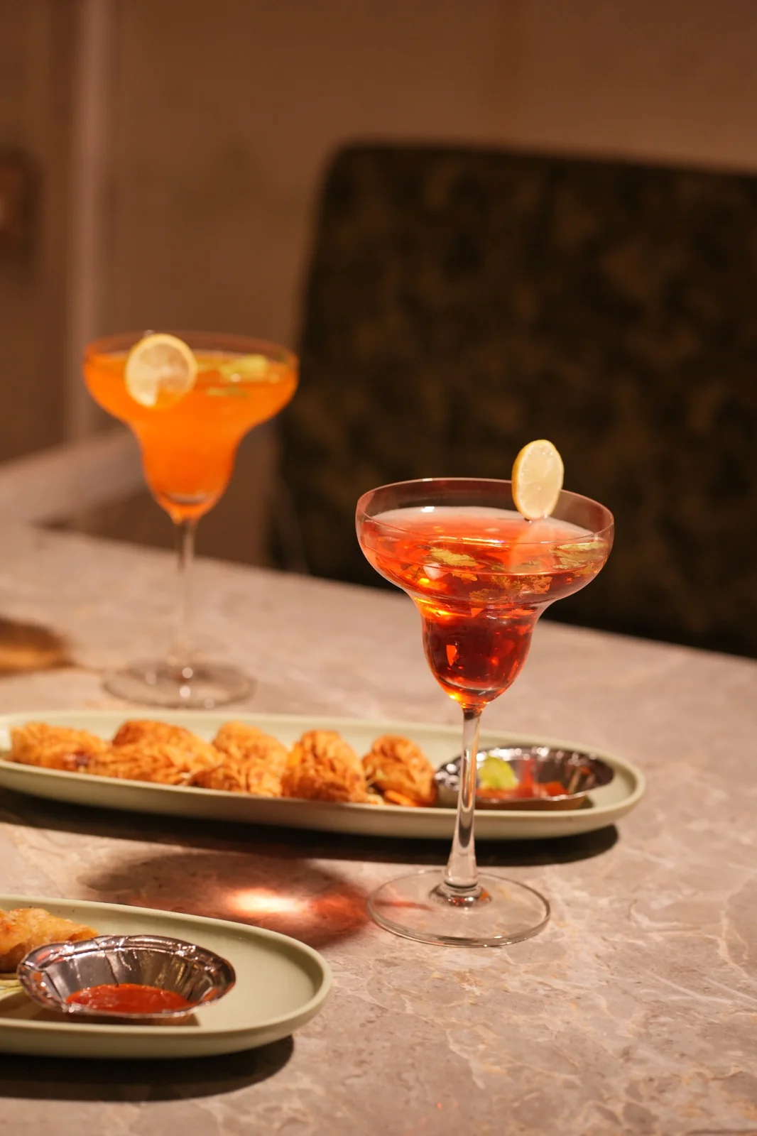 Pasta, noodles, snacks and colourful drinks arranged together on a cafe table. Nasha Chai Sutra, SFS Mansarovar Jaipur.