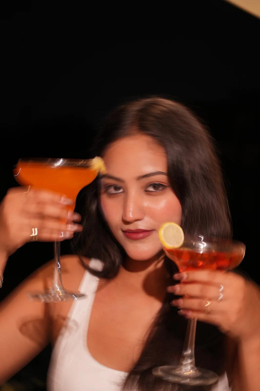 A guest enjoying an orange and a red drink at the cafe. Nasha Chai Sutra, SFS Mansarovar Jaipur.